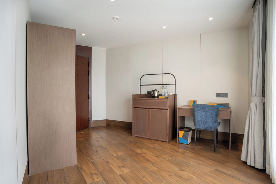 Luxury Suite, City View | Living area | 43-inch Smart TV with digital channels