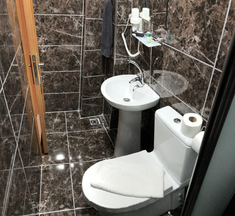Shower, rainfall showerhead, designer toiletries, hair dryer