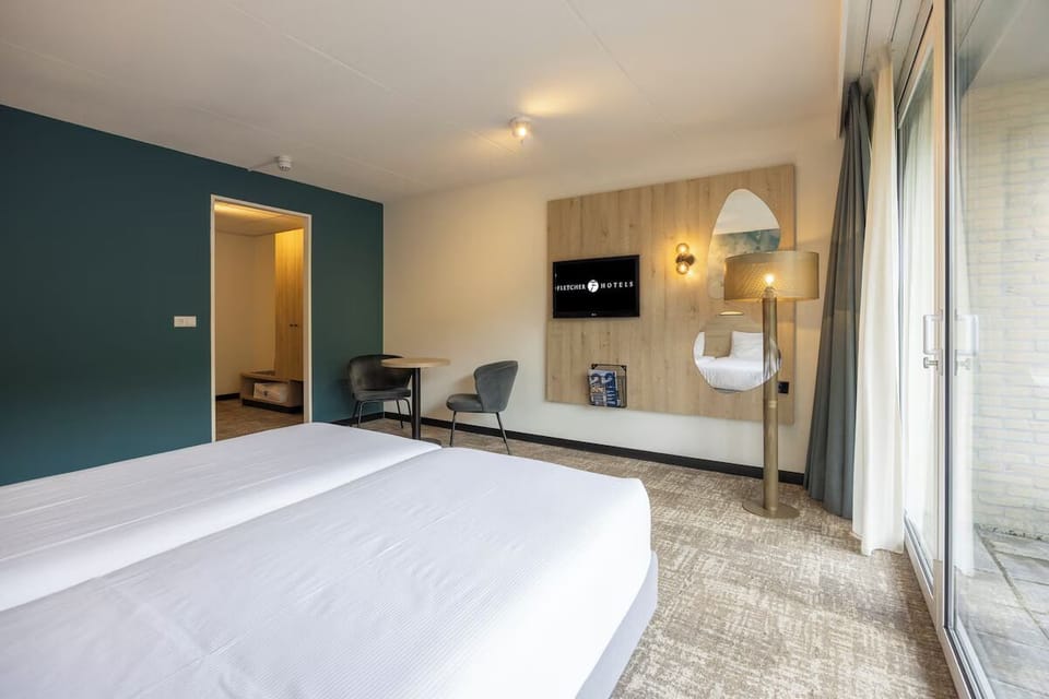 Stretch out in a spacious room with a cozy sitting corner.