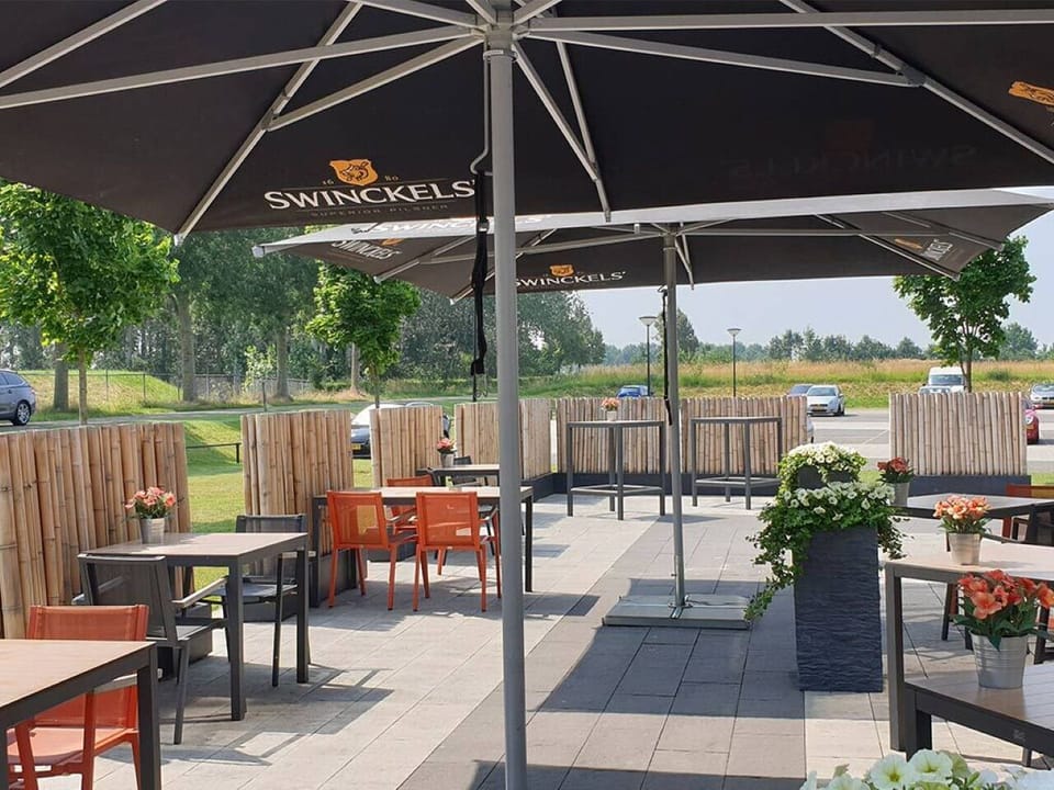 Sip a cold drink outside under shady umbrellas.