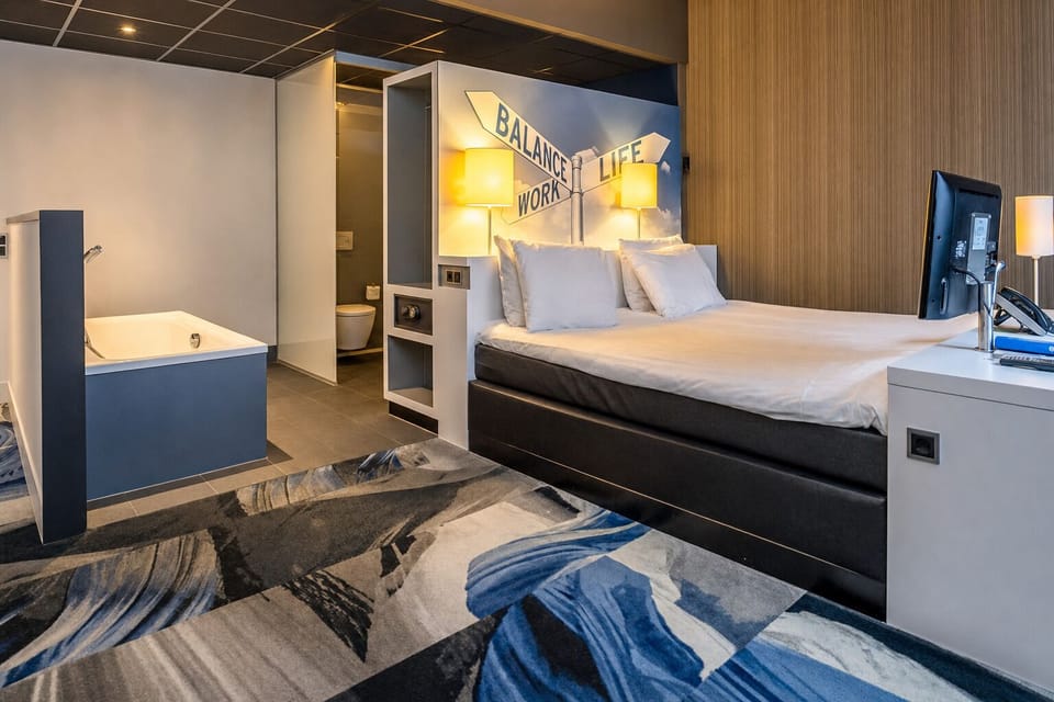 Soak in the in-room tub, then drift into plush sleep.