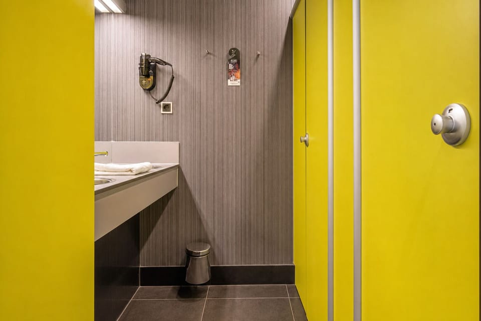 Step into a private shower area for a quick reset.