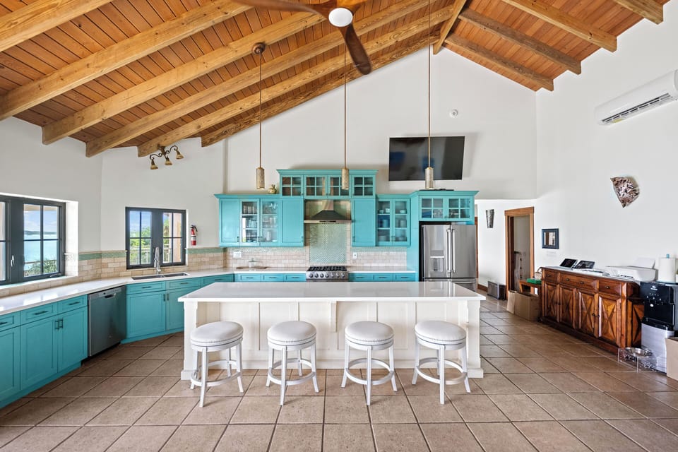 Alta Bella Villa's teal ocean colored kitchen