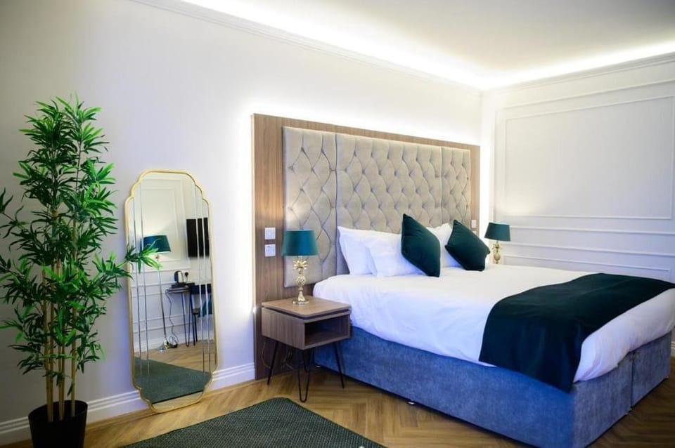 Family Triple Room, Garden View | Desk, iron/ironing board, free WiFi, bed sheets