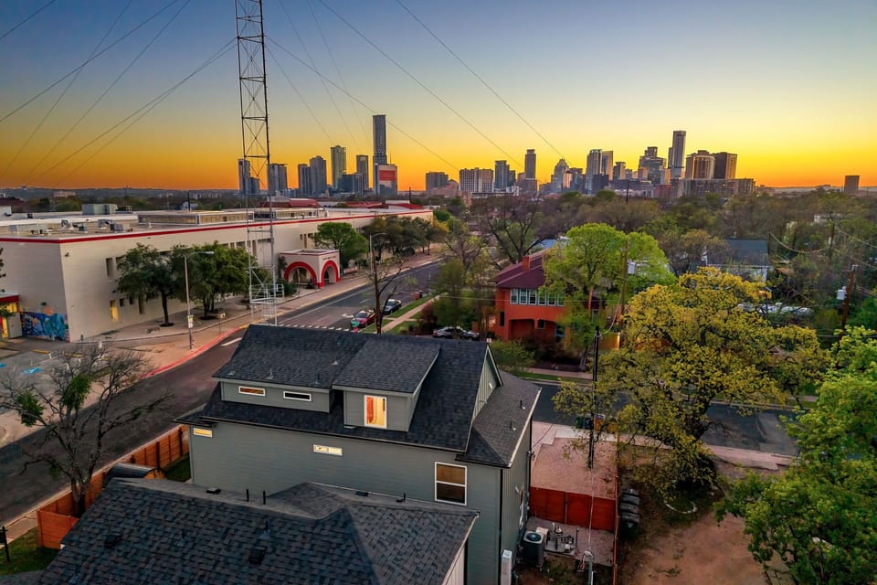 Beautiful home near the city with stunning skyline views at sunset