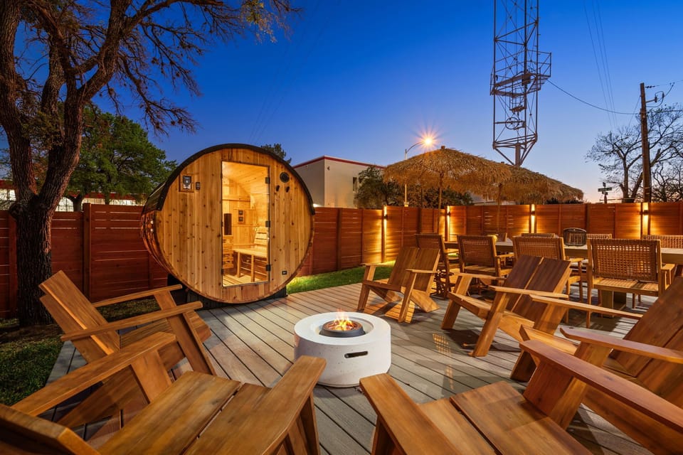 Backyard oasis with pool, lounge chairs, and outdoor seating