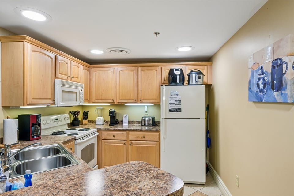 Your fully equipped kitchen awaits with granite counters, modern appliances, and everything needed to create memorable meals during your stay.