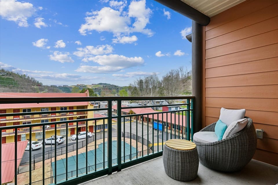 Relax on your private balcony with wicker seating and stunning countryside views stretching to rolling hills.