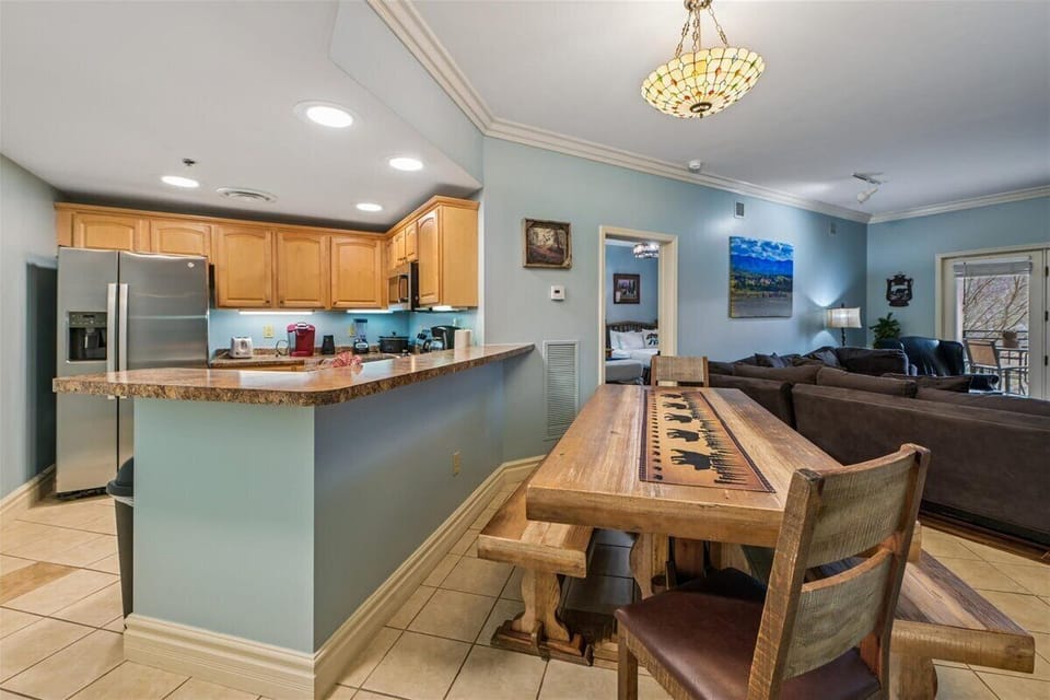 Unwind in your spacious open-plan living space where the kitchen flows seamlessly into the cozy lounge area, perfect for gathering.