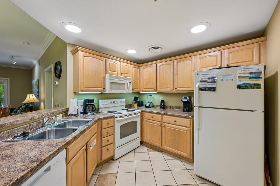 Your fully equipped kitchen awaits with granite countertops, coffee maker, and everything needed to prepare meals during your stay.
