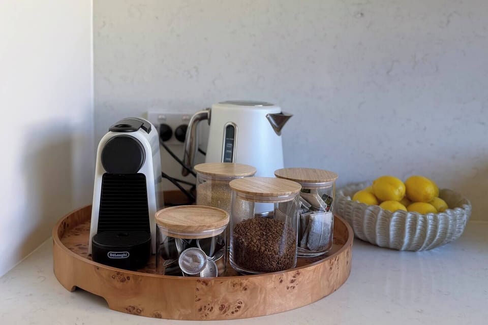 Start your morning slowly at the coffee station before heading out for a swim at East Manly Cove Beach.