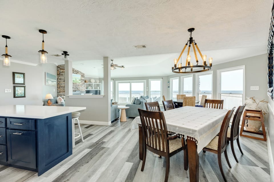 The adjacent dining area has 2 tables