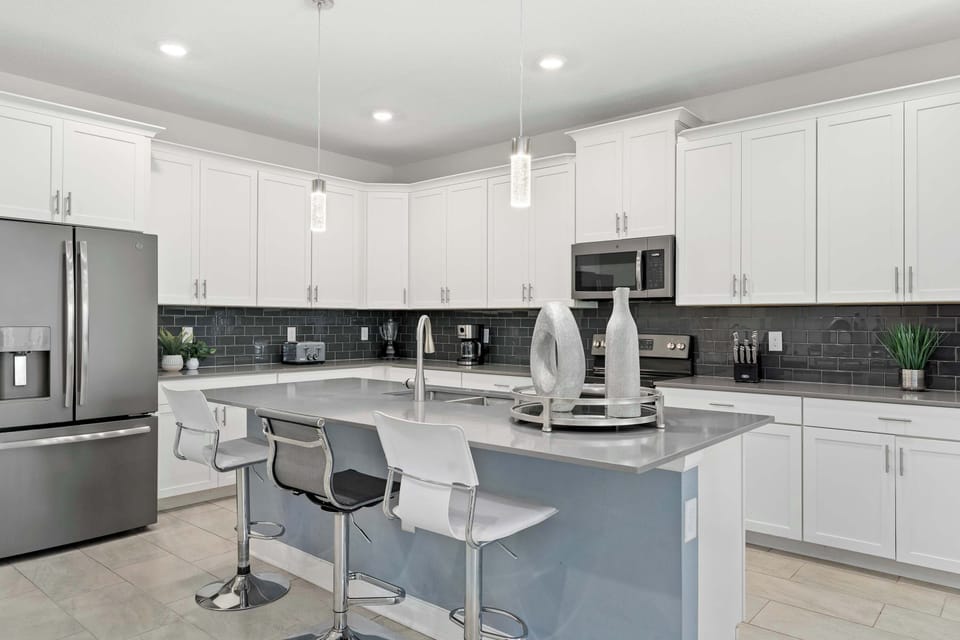 Cook in style with sleek quartz countertops and premium stainless steel appliances.