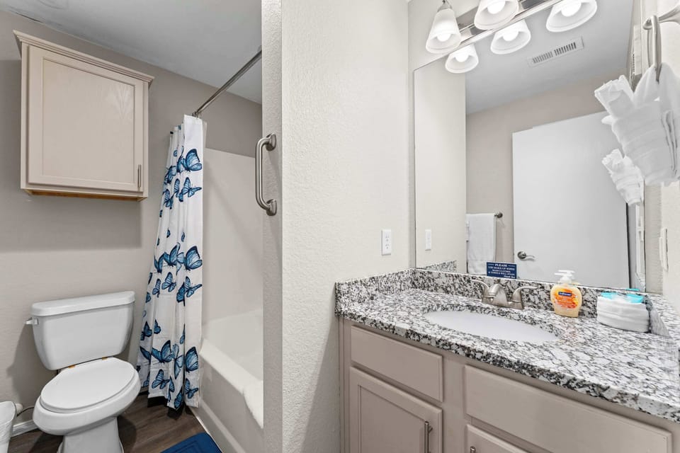 Wash up in the second full bath, showcasing a single vanity & shower/tub combo​