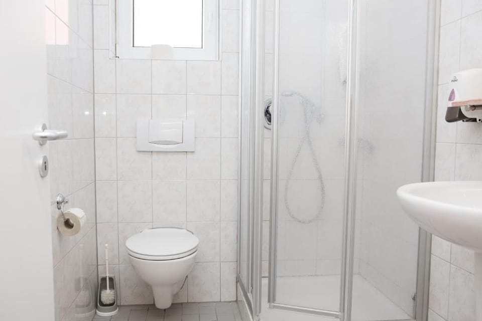 Standard Double Room | Bathroom | Shower, hair dryer, towels, soap