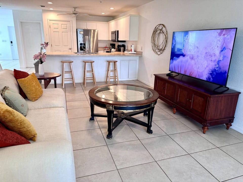 The living room area is fully integrated into the kitchen