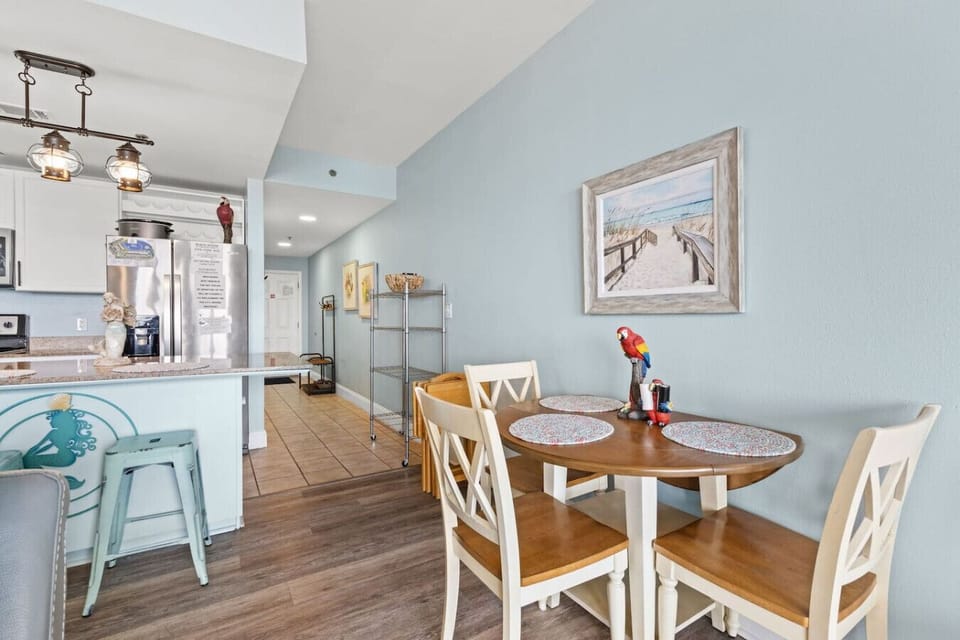 Cozy dining area with seating for four, ideal for meals or game nights.