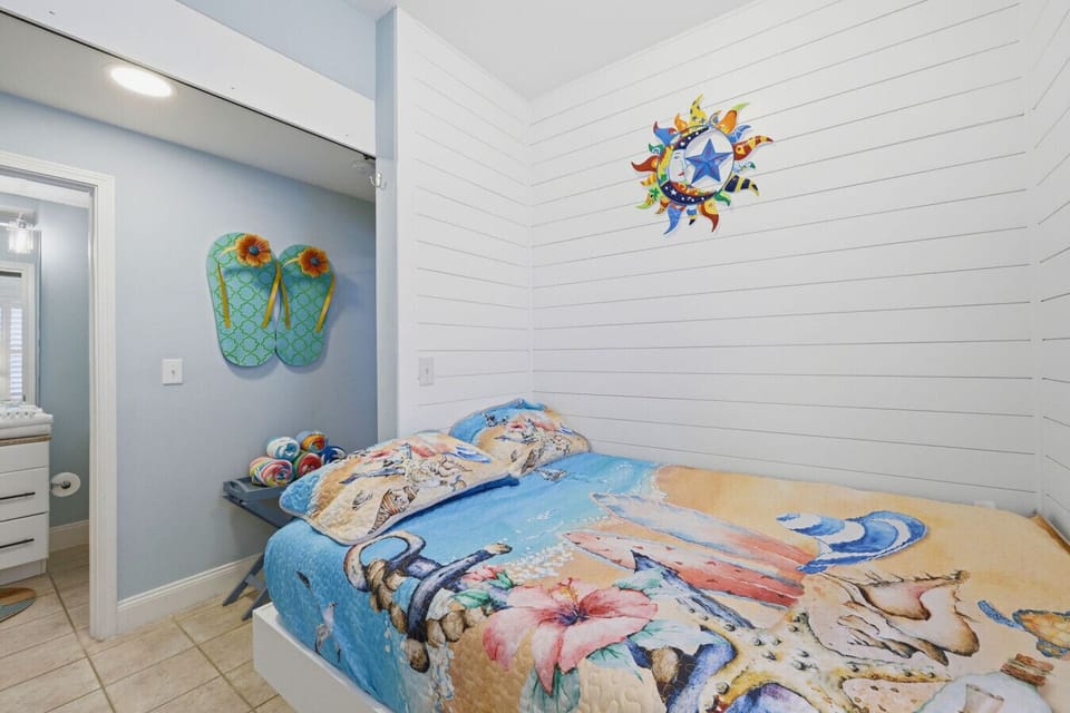 Private bunk alcove tucked just off the hallway, featuring a barn door for privacy—perfect for kids or extra guests.