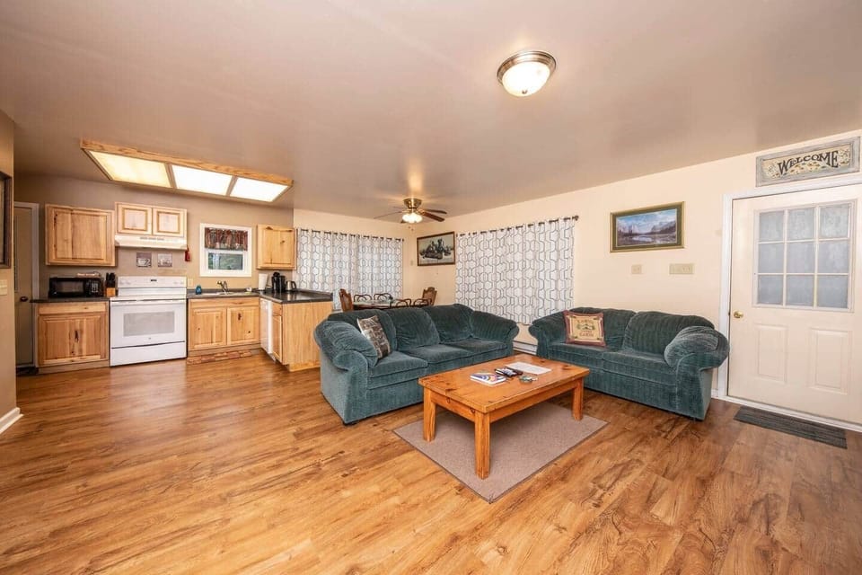 Open concept living space with a kitchen, living room, and dining room.