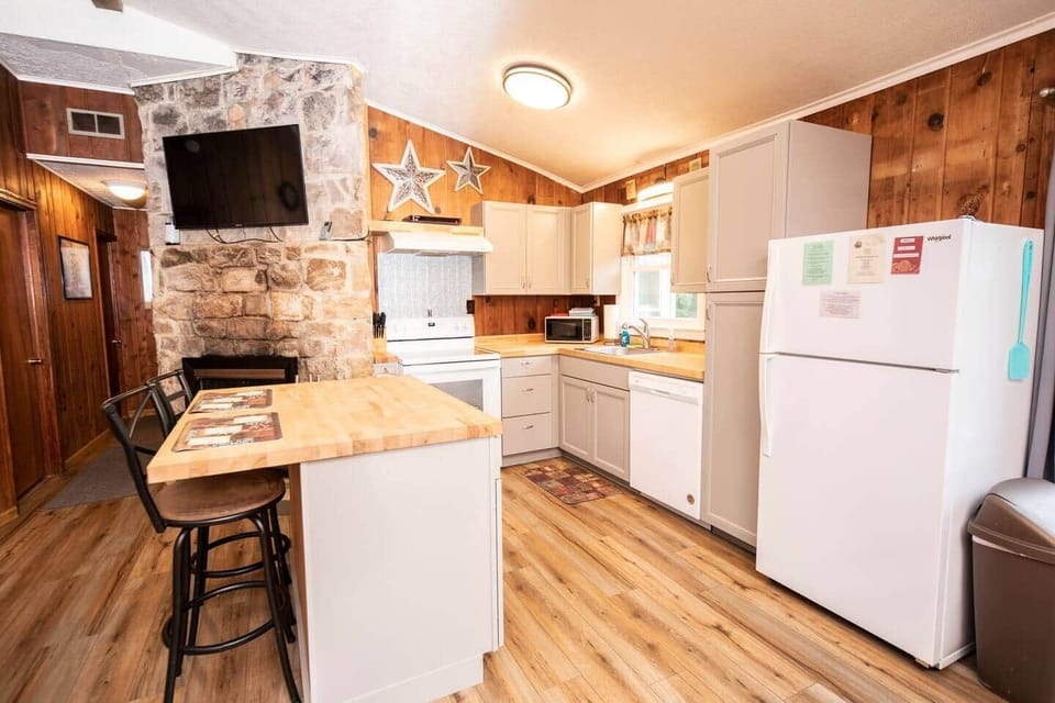 fully equipped kitchen area with large island for extra counter space and seating