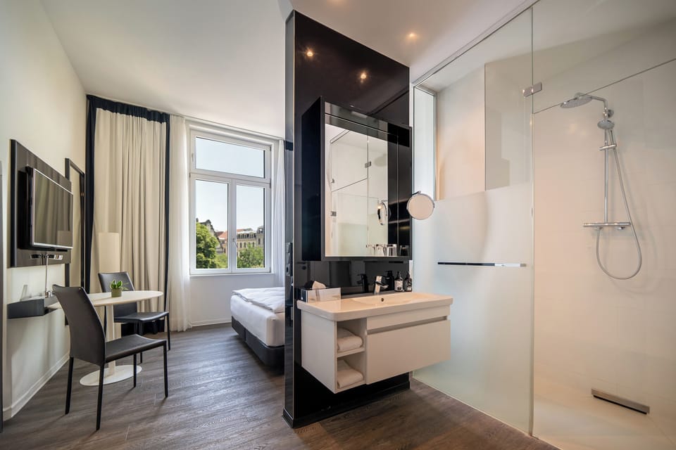 Shower, rainfall showerhead, designer toiletries, hair dryer