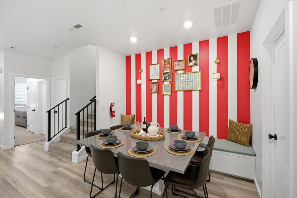 Dining Room: Vibrant stripes and chic decor create the perfect backdrop for unforgettable gatherings!