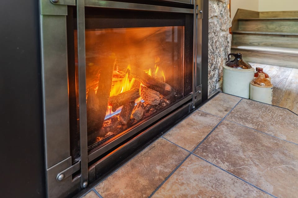 Stone propane fireplace, lit and pre-warmed before you arrive