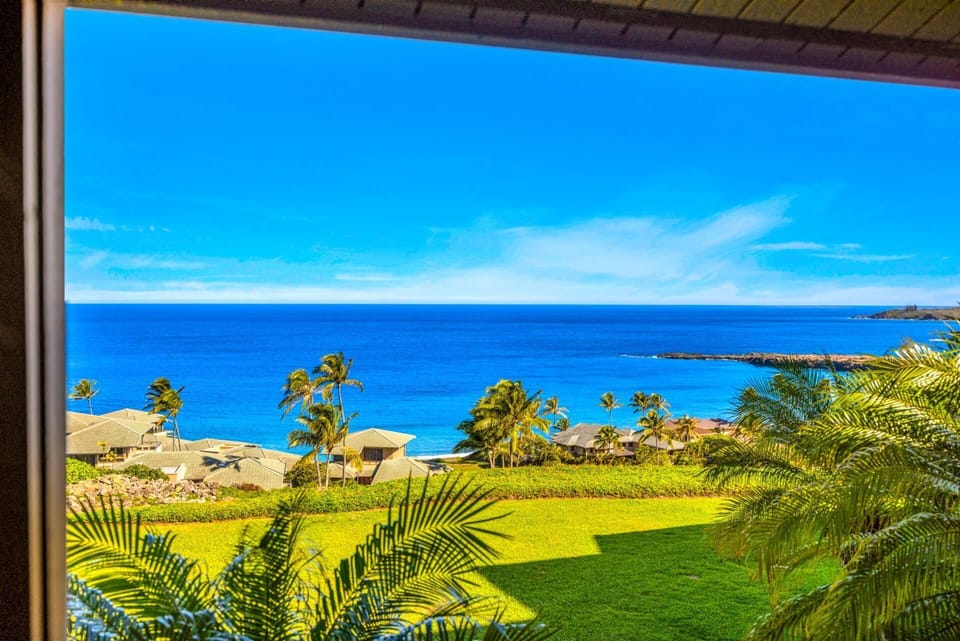 Take in palm-lined coastline views and blue water stretching toward the horizon from your balcony. KRV-2421