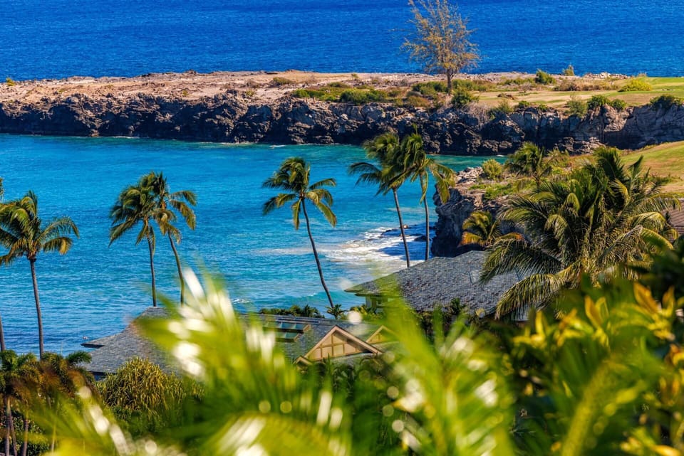 Gaze out over lava cliffs, golden sand, and lush landscaping. This is your corner of paradise. KRV-2421