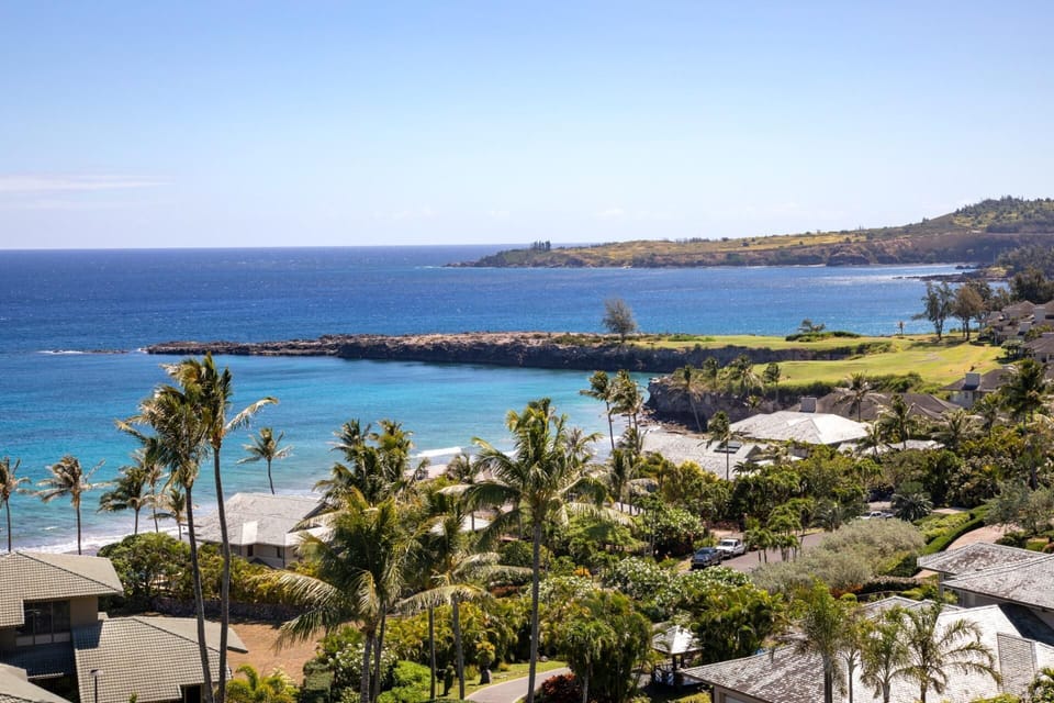 Nestled in the sky’s gentle hush, this lanai cocoons you in warmth, bloom, and ocean-born reverie    KRV-2823