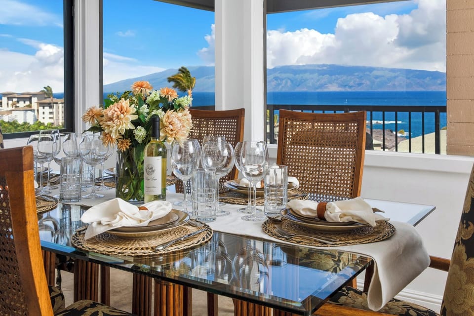 Elegant ocean-view dining with tropical charm and luxury glass setting. KRV-2912