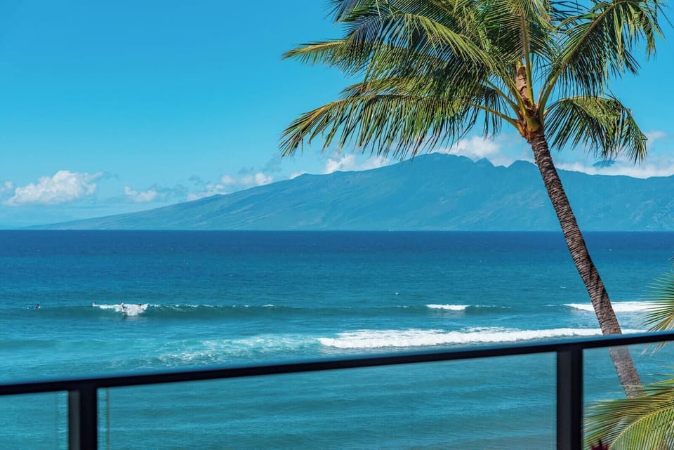 Here, the only thing more inviting than the lanai is the view—rolling surf, sun-drenched sand, and swaying palms MAH-419