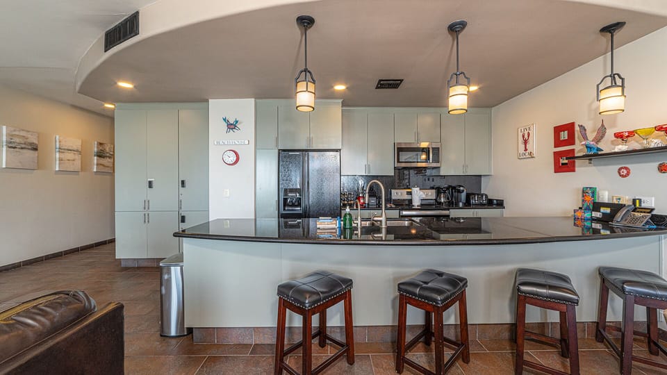 Bar stools at the kitchen counter.