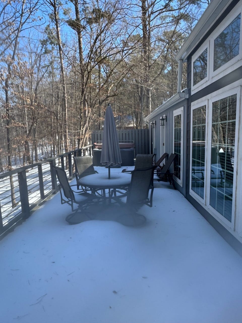 Snowy deck with outdoor dining