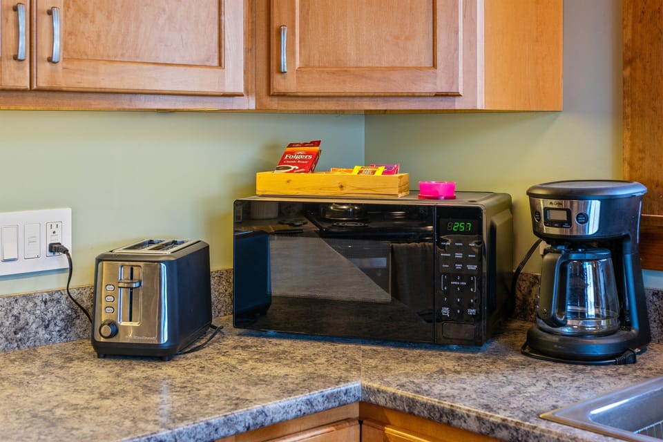 Your morning starts here. This dedicated coffee station includes a drip brewer and a selection of teas and coffee. Together with the microwave and toaster, it’s all part of a well-provisioned setup designed for easy Quiet Side mornings.