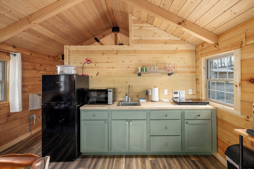 Kitchenette with crockpot, hot plate, and microwave.