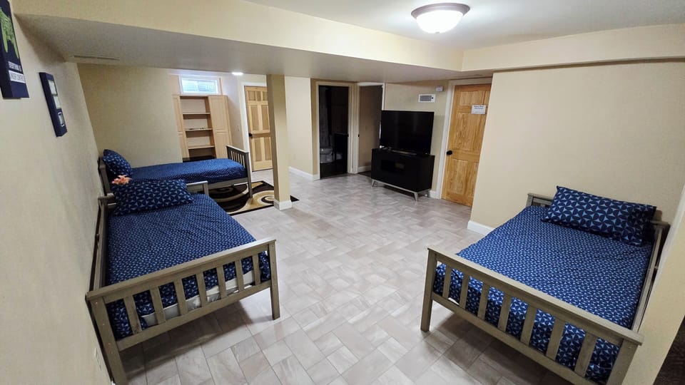room #5  two- queen size beds with Tv