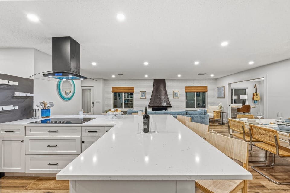 The kitchen island offers extra seating and space for casual meals.
