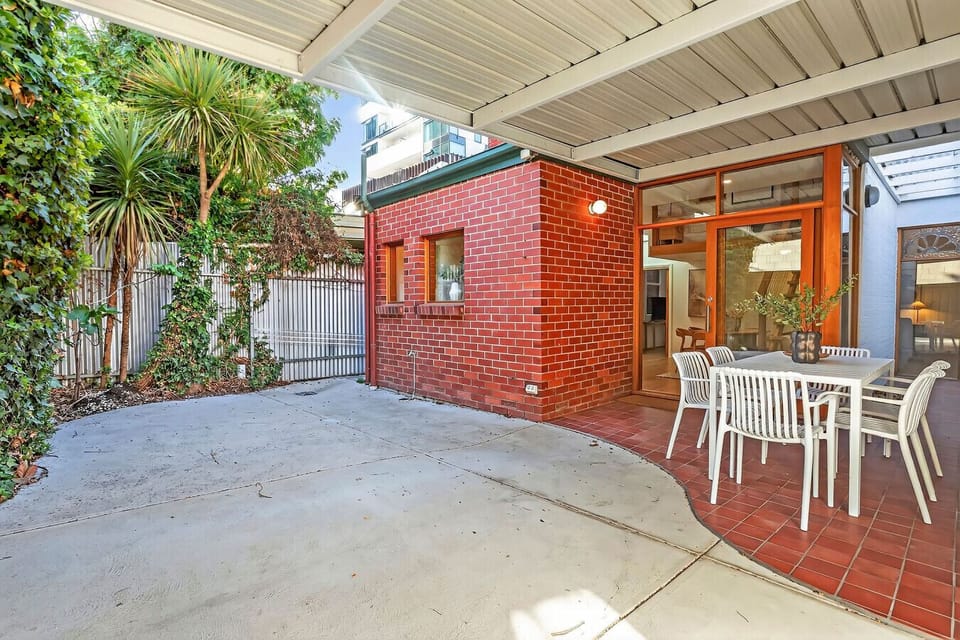 Private courtyard with outdoor seating, ideal for relaxing.