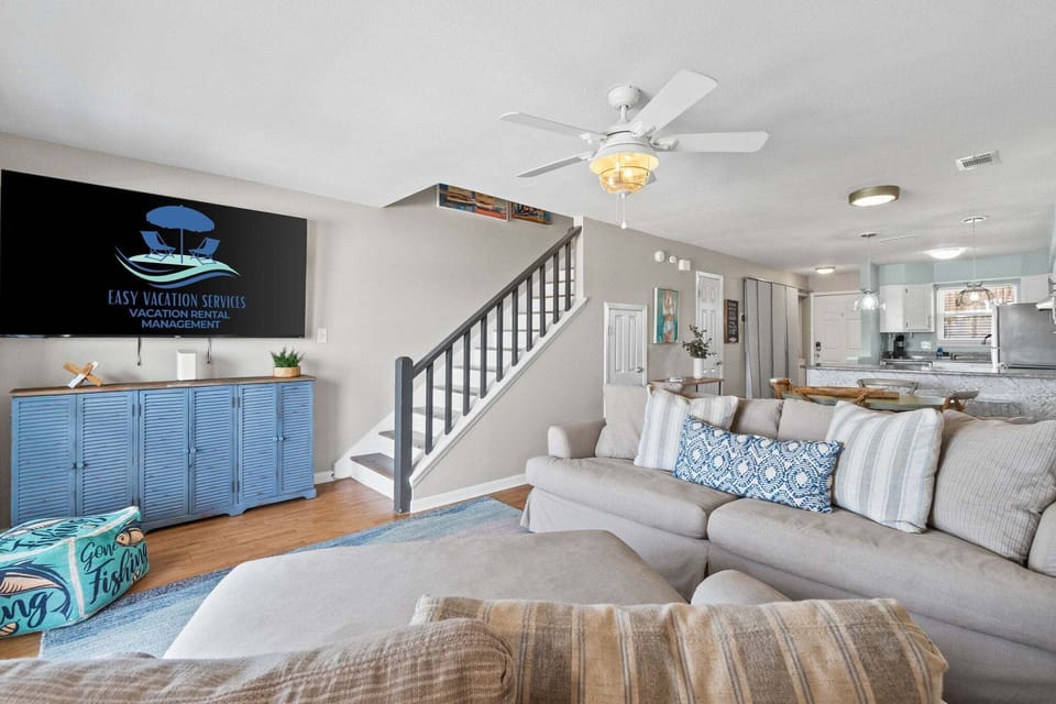 Living Room ~ Smart TV ~ Balcony Access ~ Open to Kitchen & Dining Room