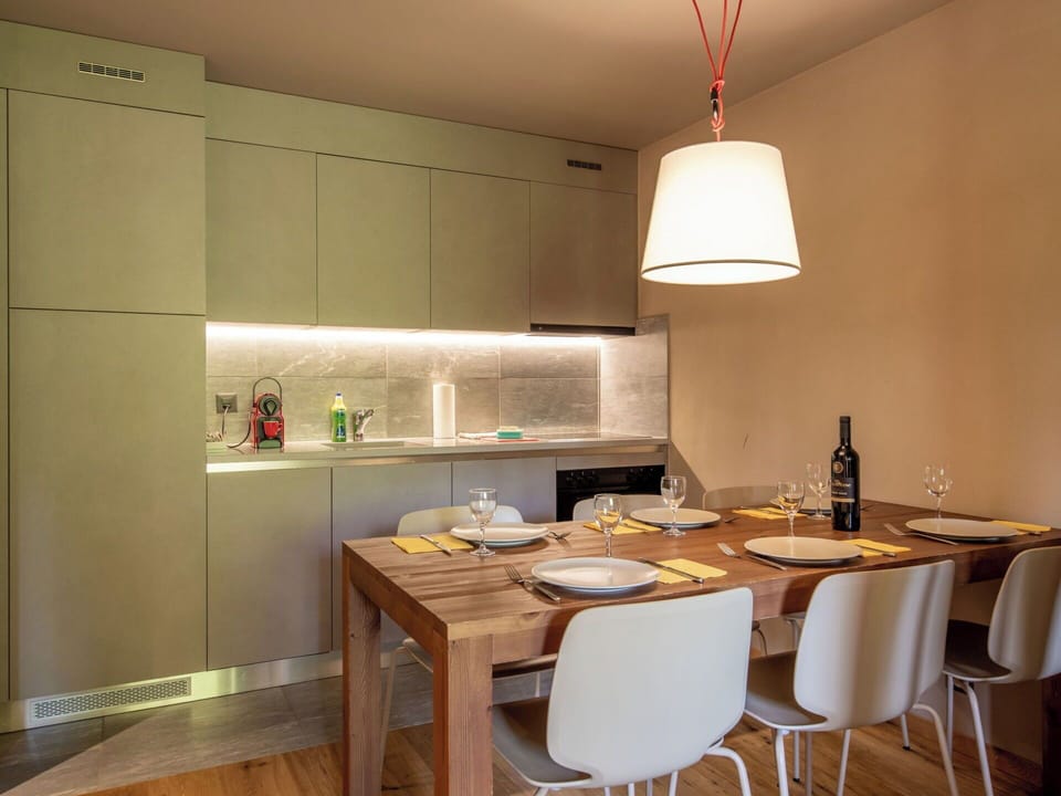 Furniture, Interior Design, Flooring, Kitchen, Wall, Countertop, Light Fixture, Floor, Wood, Ceiling