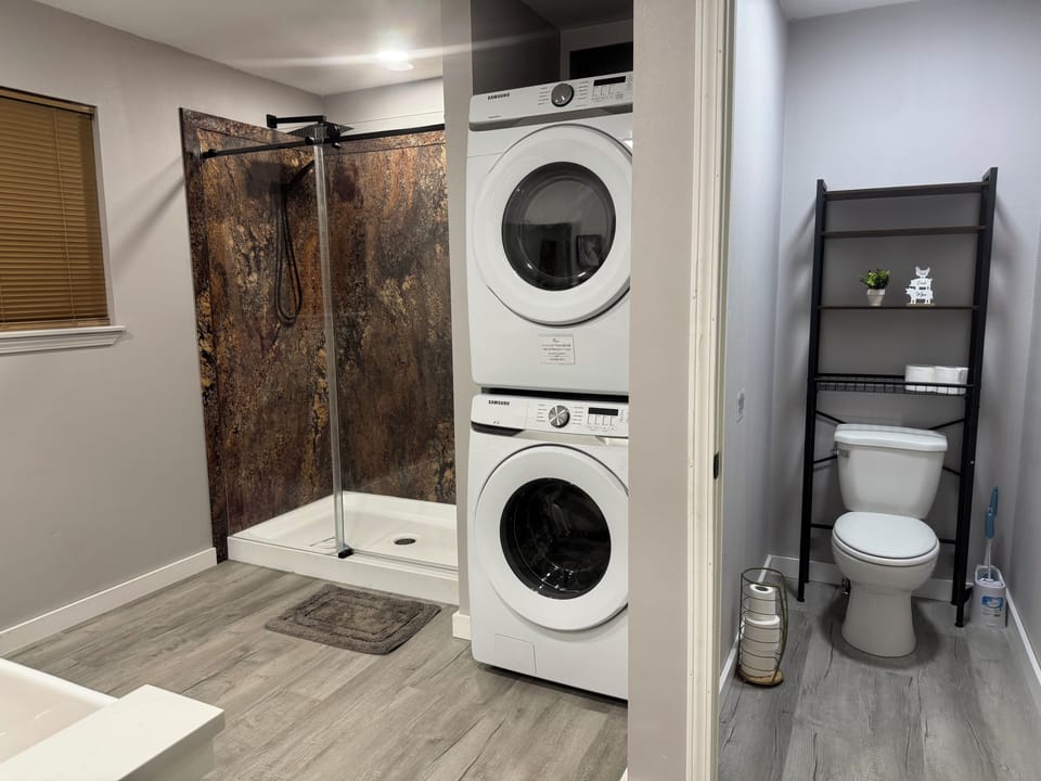 Large master bath includes private toilet room plus washer/dryer.