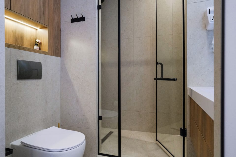 Shower, hair dryer, slippers, towels