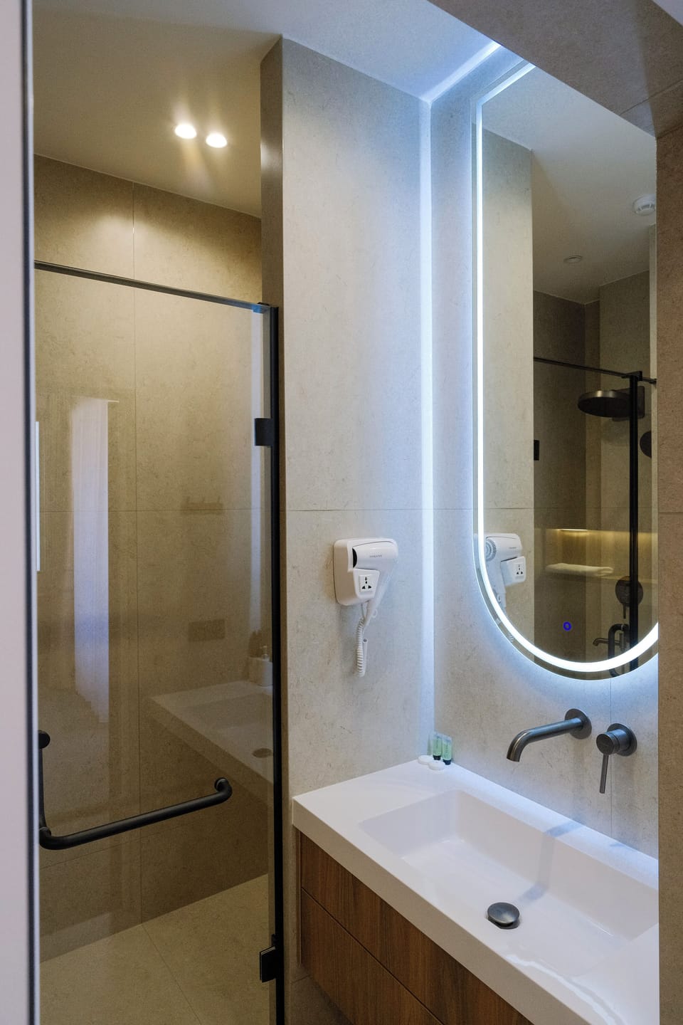 Shower, hair dryer, slippers, towels
