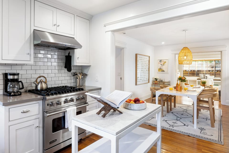 Bright kitchen with a gas range and an easy flow into the dining space.