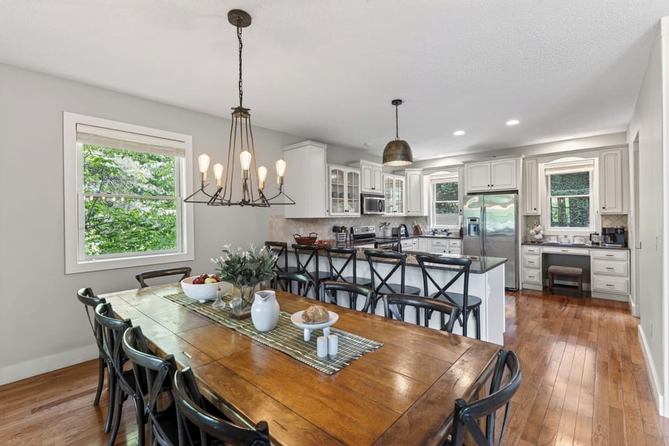 Bright dining space with seating for the whole group and easy access to the deck.