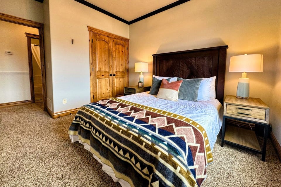 Bedroom #2 enjoys a queen bed and a spacious closet.