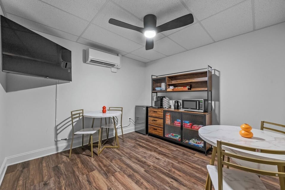 Unwind in the ground-floor community lounge, featuring a TV, board games, and cozy seating in downtown Asheville.