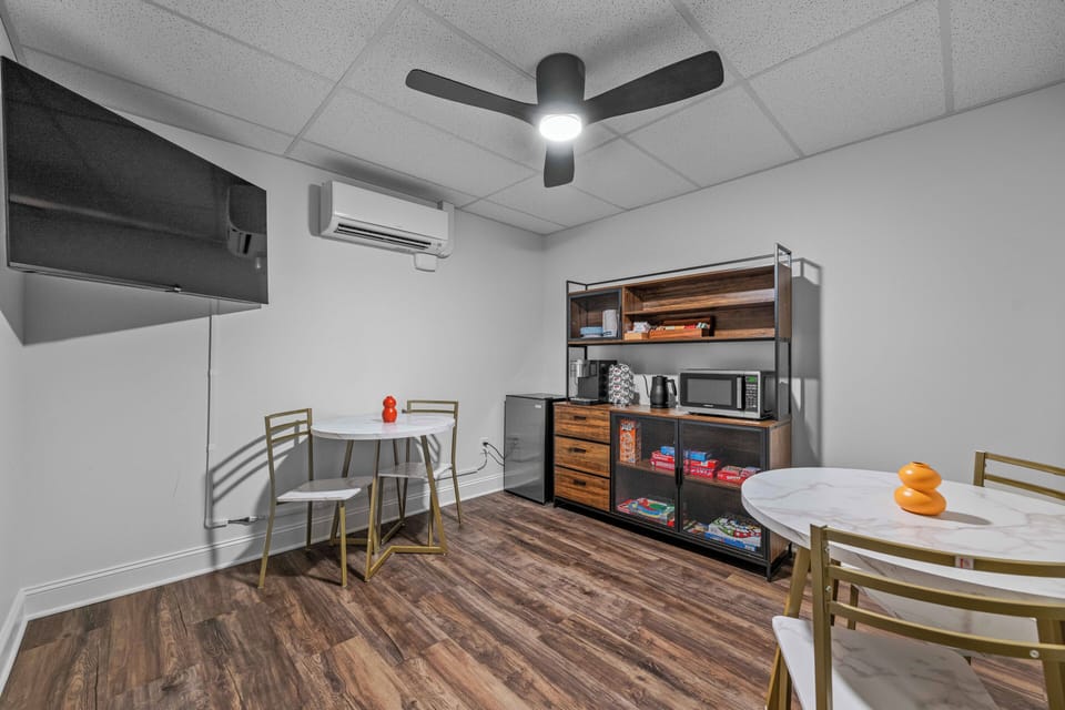 Guests enjoy access to shared amenities including a coffee station, microwave, mini fridge, and light snack options — a convenient bonus to your private Deluxe King Suite.