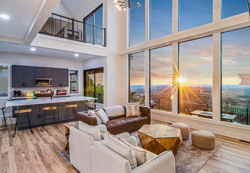 As the sun filters through, the living room glows with warmth and comfort, creating an inviting atmosphere.